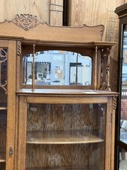 Antique Oak Display Cabinet with Carved Details and Curved Glass