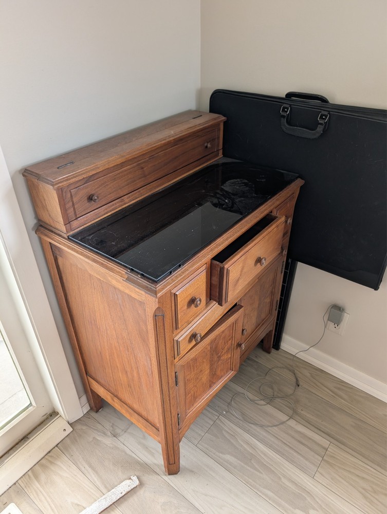 brown wooden retro console table black glass counter with drawers