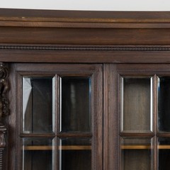 20th Century Danish Oak Display Cabinet with Carved Putti and Beveled Glass