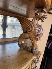 R. J. HORNER WINGED GRIFFIN HOODED BOWED GLASS OAK CHINA CABINET