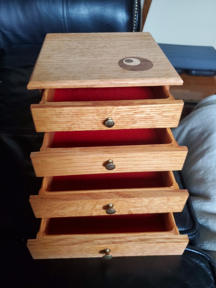 oak filing or collection cabinet with brass knobs