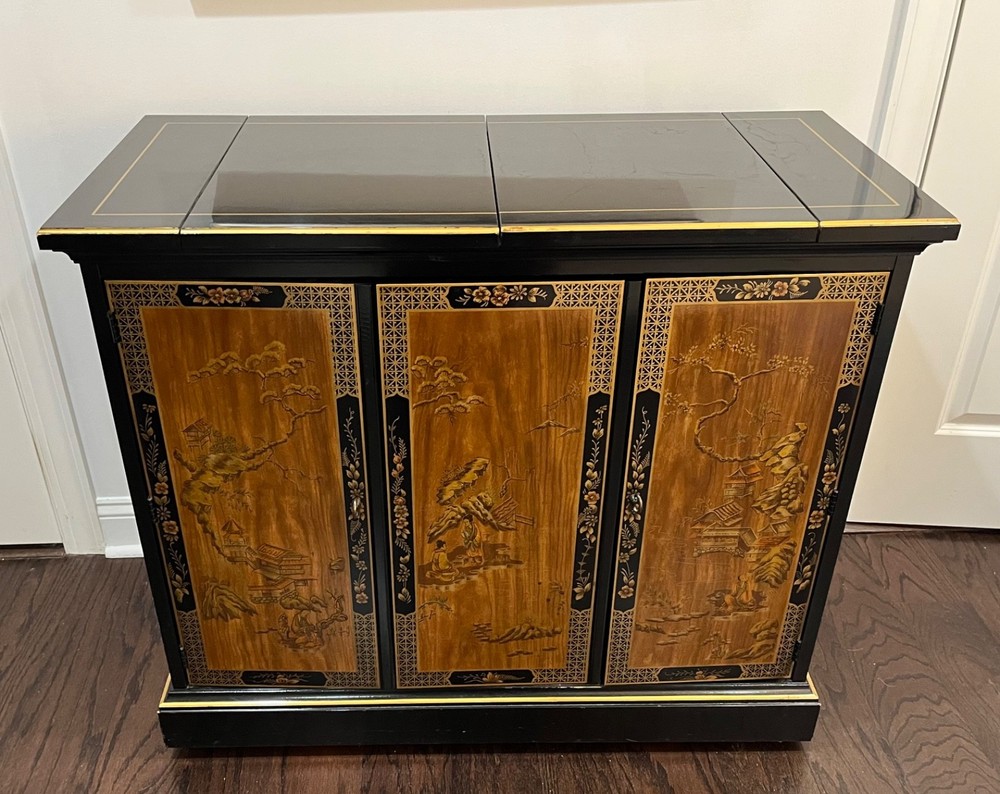 Drexler 1970’s chinoisserie style bar/cabinet on wherls.
