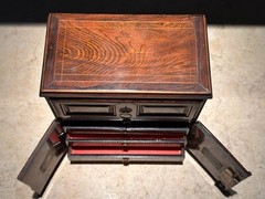 AN UNUSUAL MINIATURE CARVED WOOD APPRENTICE CABINET