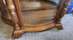 Victorian Carved Oak Curio Cabinet with Beveled Glass and Claw Feet Accents