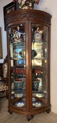 Antique Oak Corner Curio China Cabinet Beveled Glass Carved 80.75″ with Casters