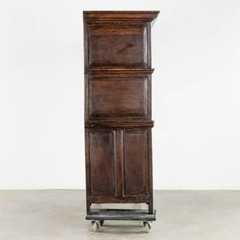 An impressive early 18th century Dutch oak geometric kussen cabinet secretaire