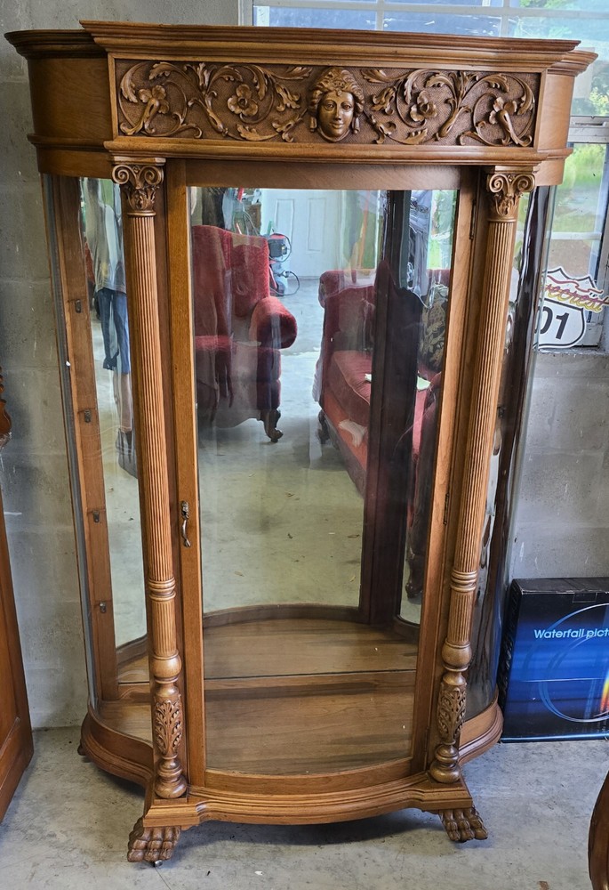 Victorian Carved Oak Curio Cabinet with Beveled Glass and Claw Feet Accents