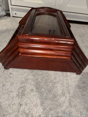 Vintage wall mounted dark wooden curio cabinet with shell shaped pediment