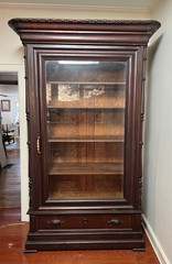 antique display cabinet with beveled glass door