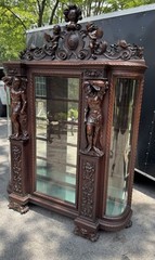 ORIEL CABINET CO. CARVED MAHOGANY MAN FIGURE CHINA CABINET