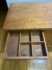 Antique apothecary with many drawers and brass handles.