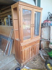 solid oak china cabinet with 4 doors and a Light in the top section